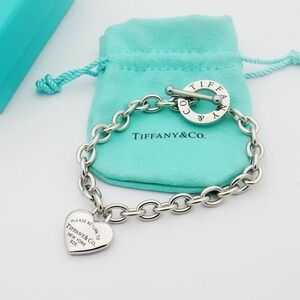 Elegant Tiffany & Co. Silver Bracelet with Heart Charm